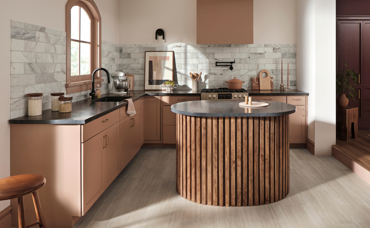 Black marble countertops in a kitchen display with green and natural countertops