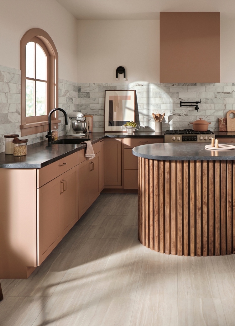 Black marble countertops in a kitchen display with green and natural countertops