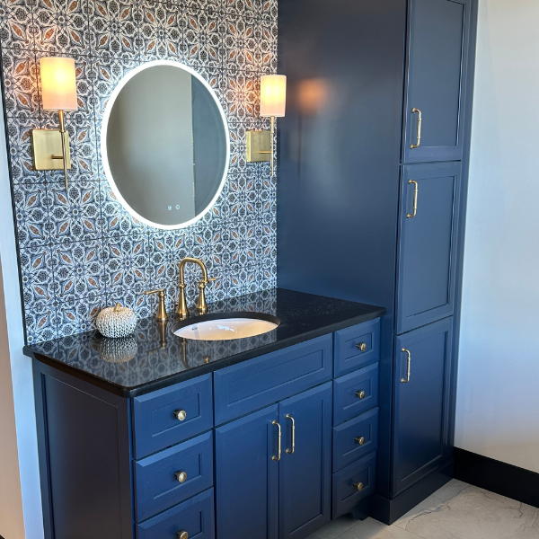 Blue cabinetry in a bathroom with walk-in shower
